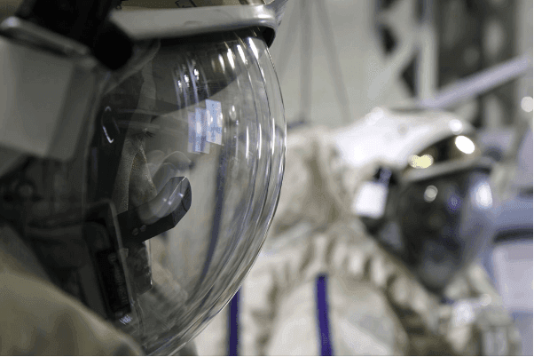 Close-up of spacesuit helmets
