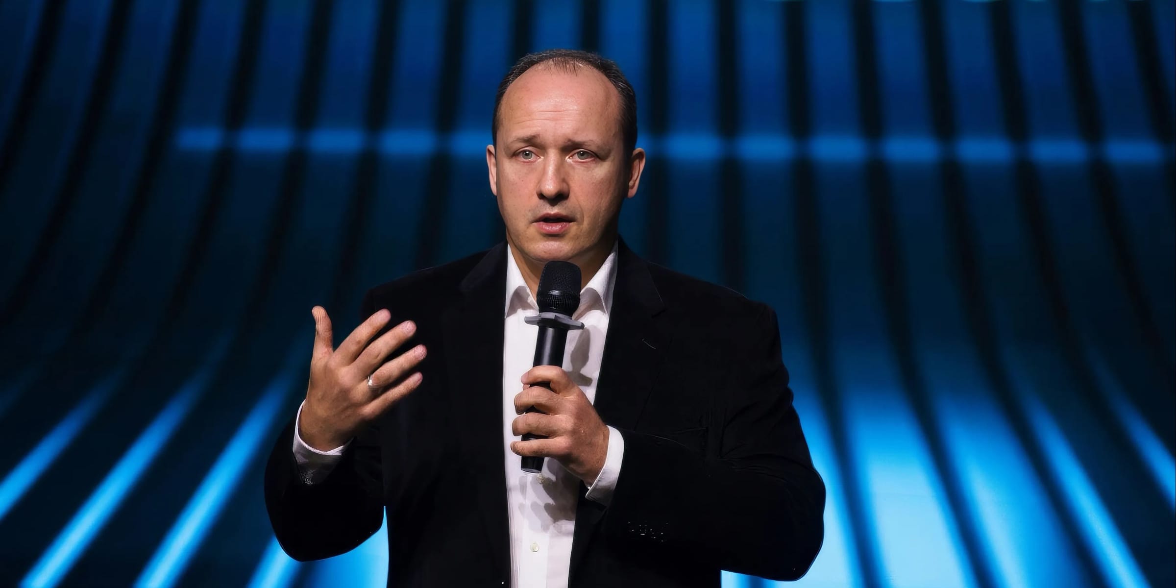 Cosmonaut Alexander Misurkin speaking on stage