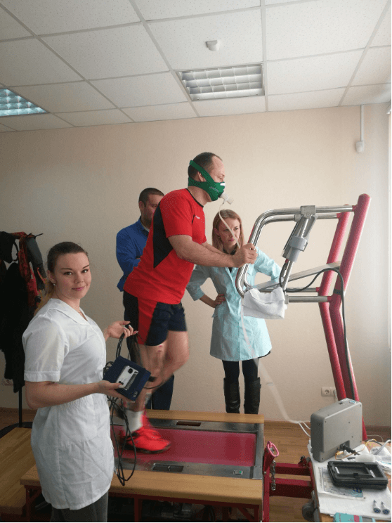 A treadmill stress test supervised by medical staff