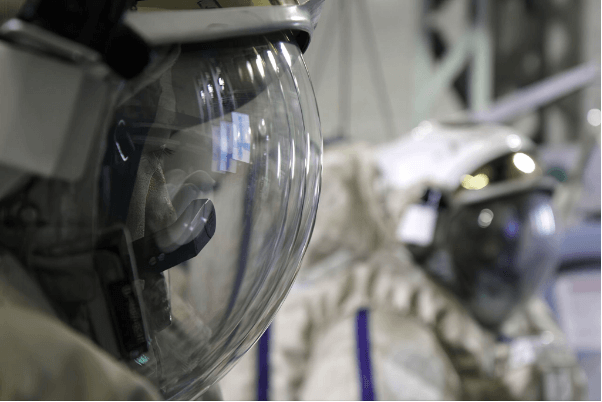 Close-up of spacesuit helmets