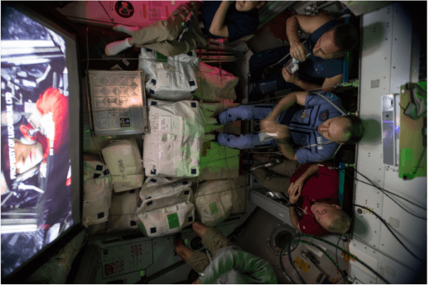 A crew watching a film aboard the ISS