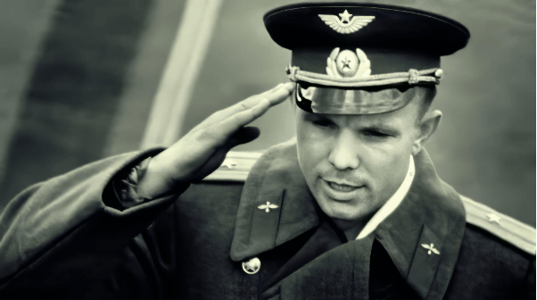 Yuri Gagarin in an officer's cap saluting