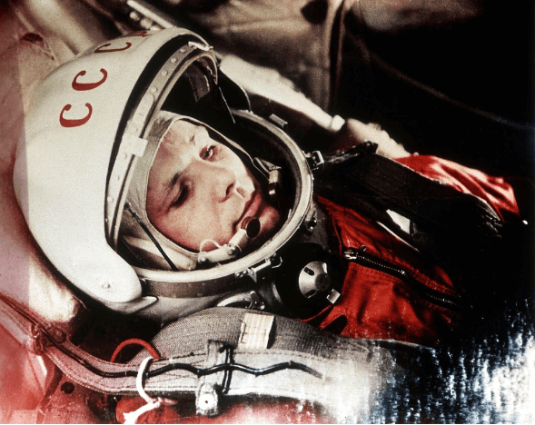 Yuri Gagarin in a spacesuit with USSR written on the helmet